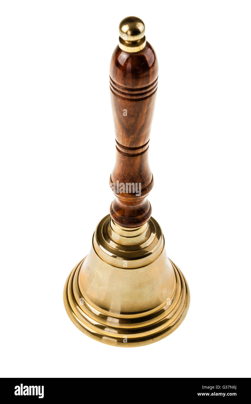 a golden hand bell isolated over a white background Stock Photo