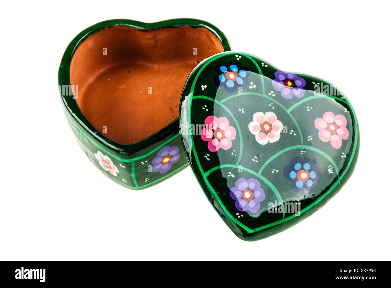 a heart shaped ceramic box isolated over a white background Stock Photo