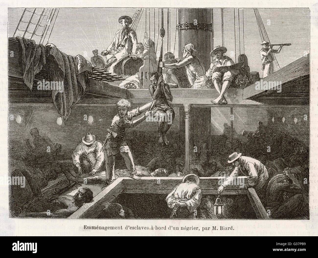 Slaves being lowered into the  hold of a slave ship         Date: 1861 Stock Photo