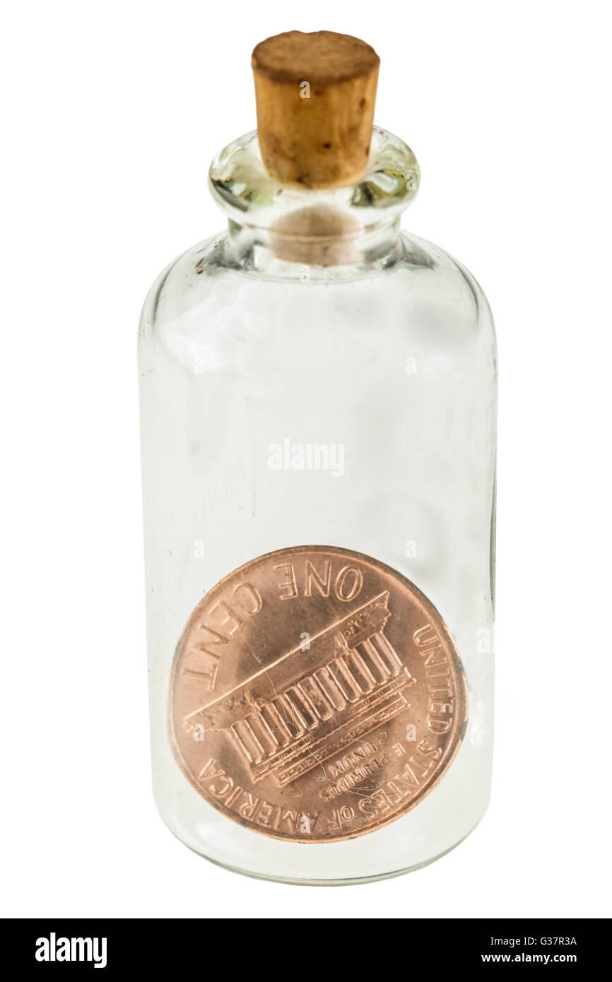 a penny in a small glass bottle isolated over a white background Stock Photo