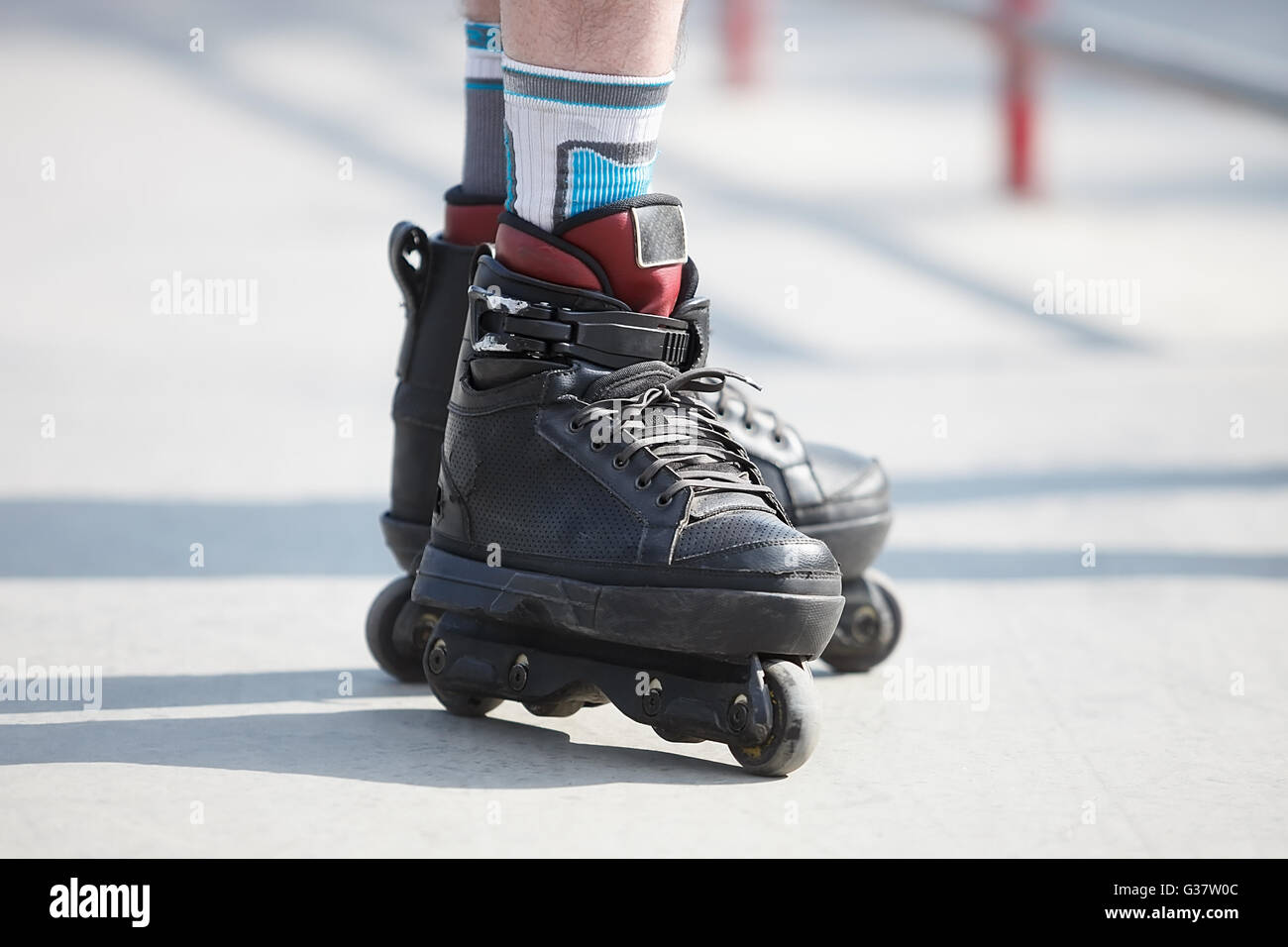 Aggressive inline skates on rollerblader feet. Extreme sports athlete