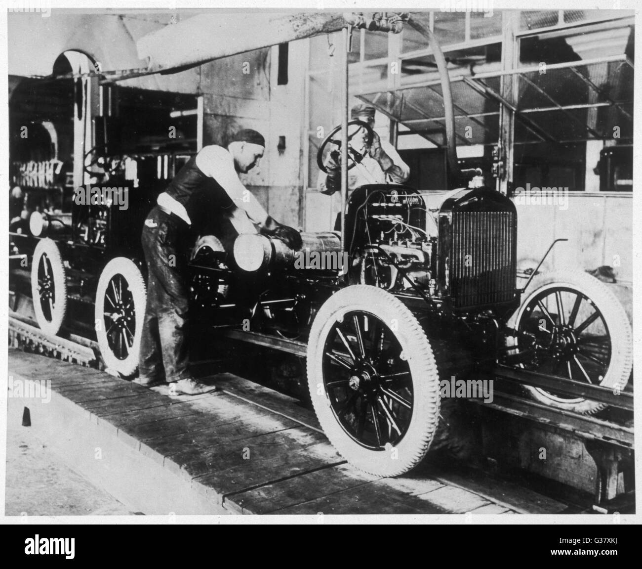 Working on the Ford assembly line in Detroit, USA, 1913.     Date: 1913 Stock Photo