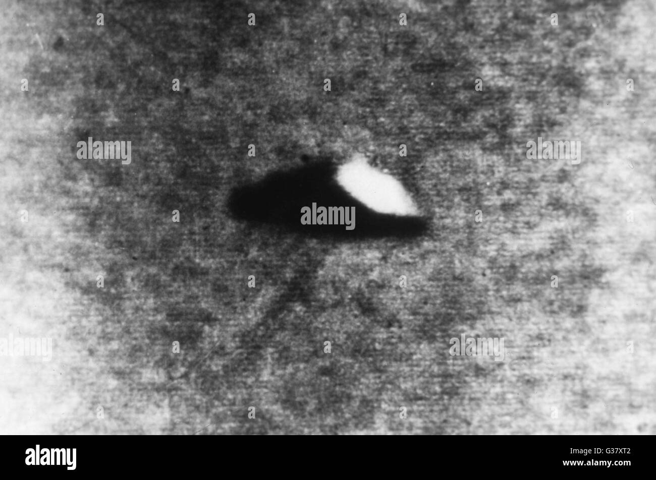 At Namur, Belgium, postman Muyldermans sees a UFO among the clouds and is able to take three photographs before it vanishes.     Date: 5 June 1955 Stock Photo