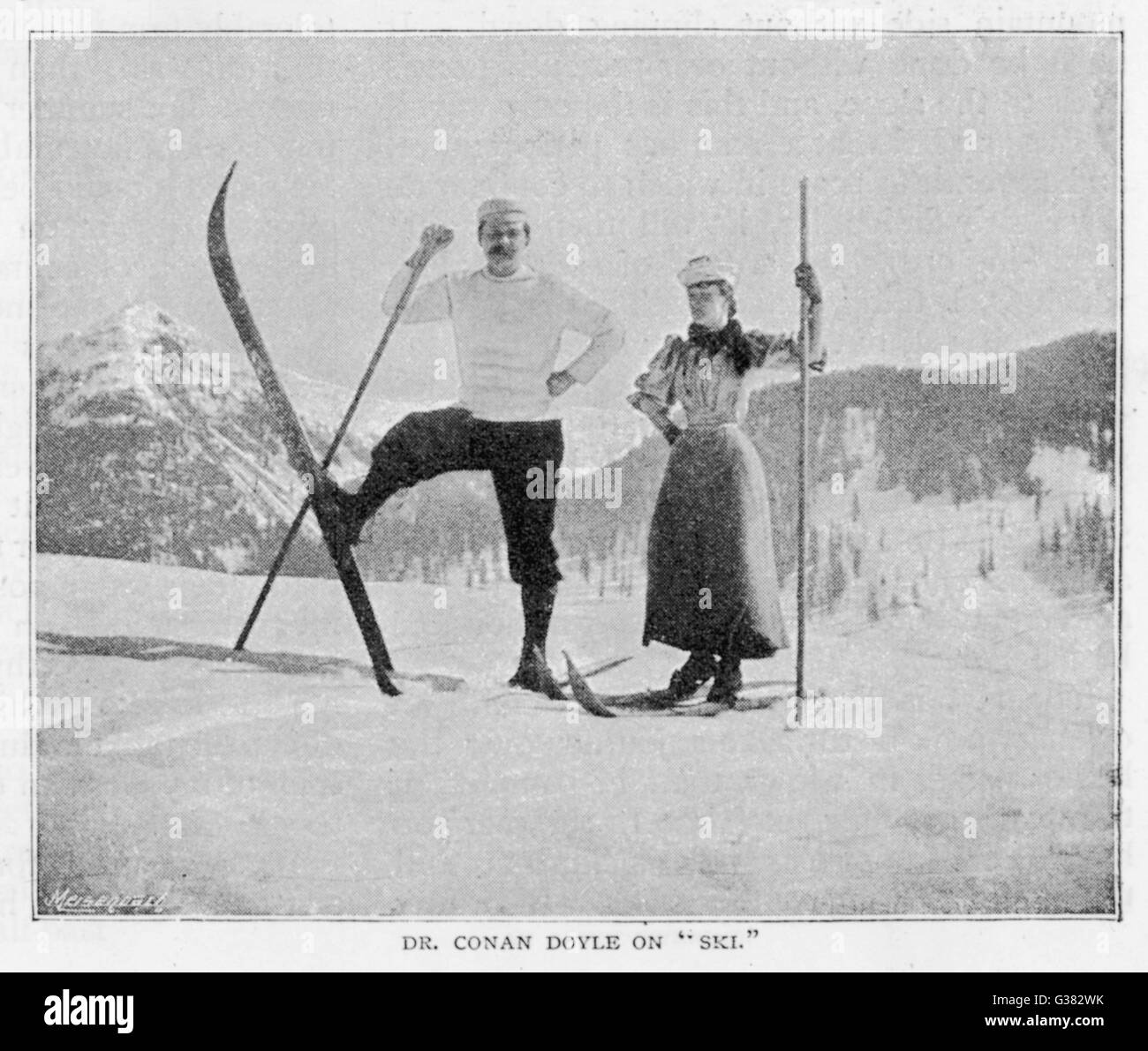 SIR ARTHUR CONAN DOYLE  In comical pose on skis in the  Alps, with female companion.       Date: 1894 Stock Photo