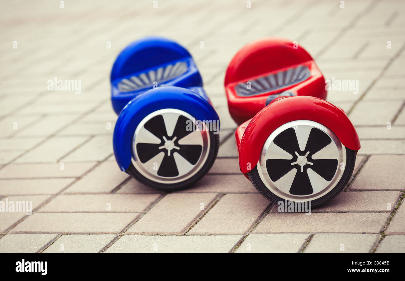 Modern transportation technology - electric mini segway scooter hover board. Easy and fun way to ride the city streets. Trending new gadget that became very popular among youth and adults. This is the future of energy effetive personal urban transport that produces no pollution to the atmosphere. Stock Photo