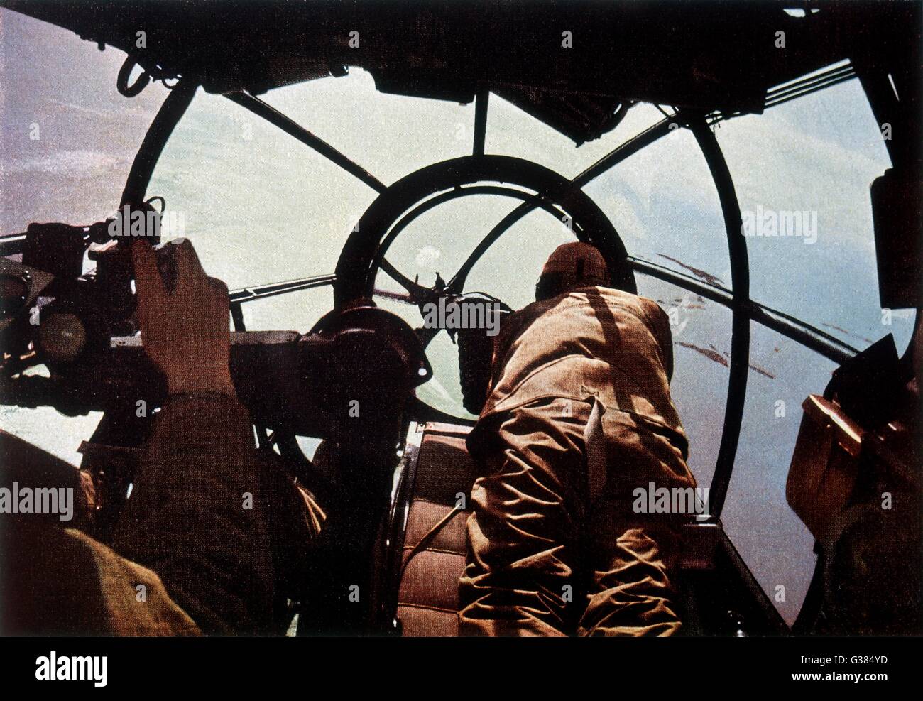 German machine-gunner in the  cockpit of a bomber - probably a Heinkel HE-111.       Date: 1940 Stock Photo