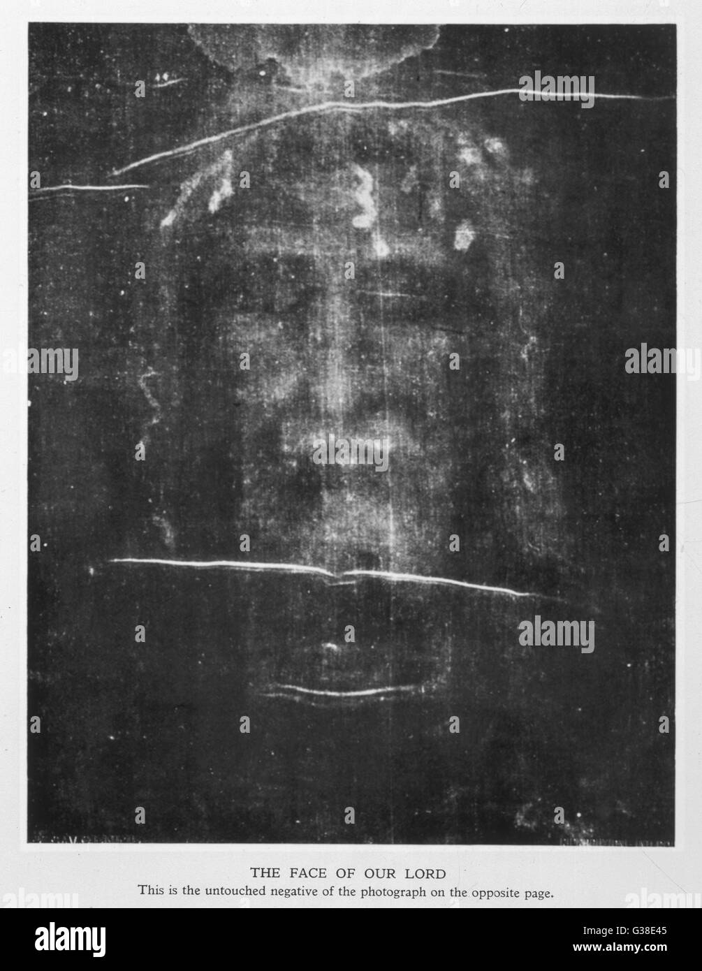 Part of the first photograph of  the Shroud, showing the face :  the image is revealed more  strongly in the negative.        Date: 1934 Stock Photo