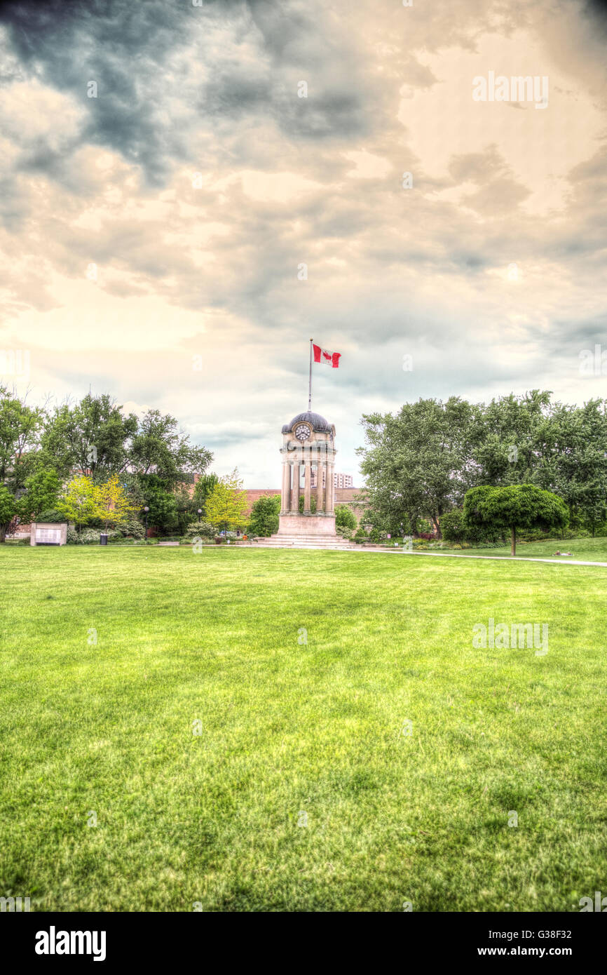 Tree and clock tower in Victoria Park in Kitchener Waterloo Ontario Stock Photo