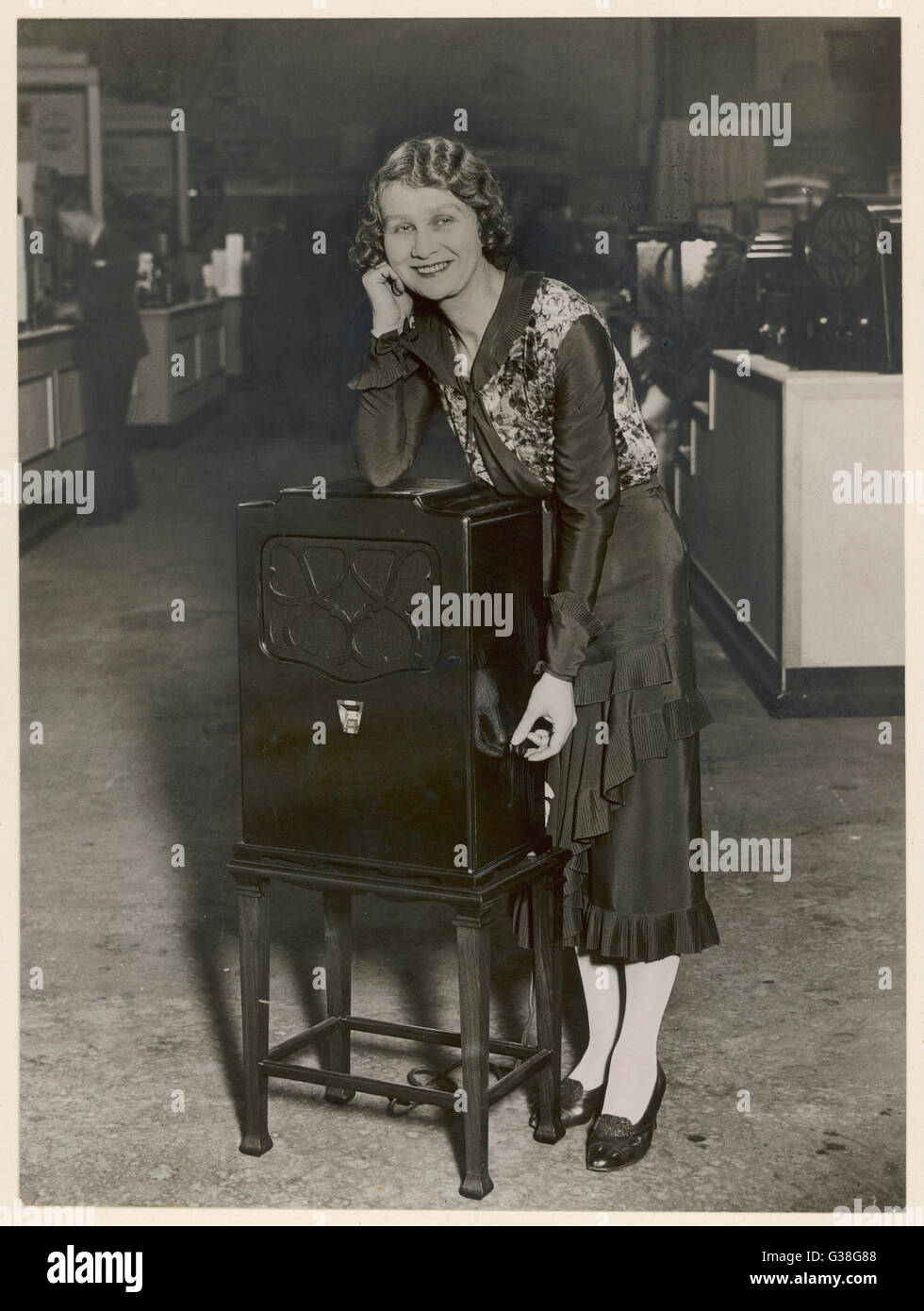 A kind lady demonstrates the  AMPHION 'SIX' for 1931         Date: 1931 Stock Photo