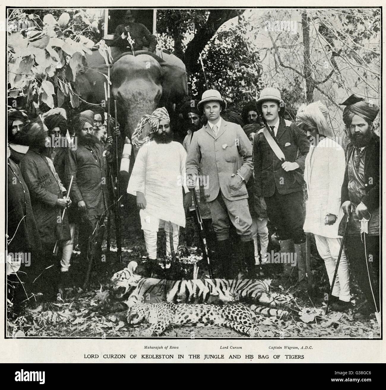 GEORGE NATHANIEL, MARQUESS  Lord Curzon of Kedleston with  the Maharaja of Rewa and  Captain Wigram &quot;in the jungle  with his bag of tigers&quot;.     Date: 1859-1925 Stock Photo