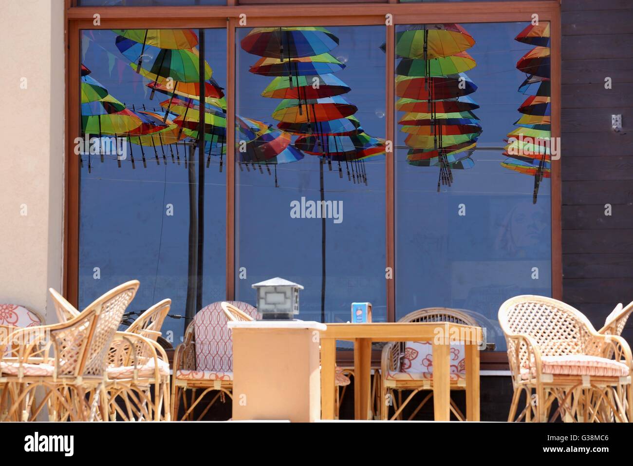 Gaza City, Gaza Strip, Palestinian Territory. 9th June, 2016. A Picture taken in June 9, 2016 shows beachside café shop was decorate its terrace with hanging colourful umbrellas as part of decorations for the Muslim holy fasting month of Ramadan in Gaza City. Ramadan is sacred to Muslims because it is during that month that tradition says the Koran was revealed to the Prophet Mohammed. The fast is one of the five main religious obligations under Islam. More than 1. Credit:  ZUMA Press, Inc./Alamy Live News Stock Photo