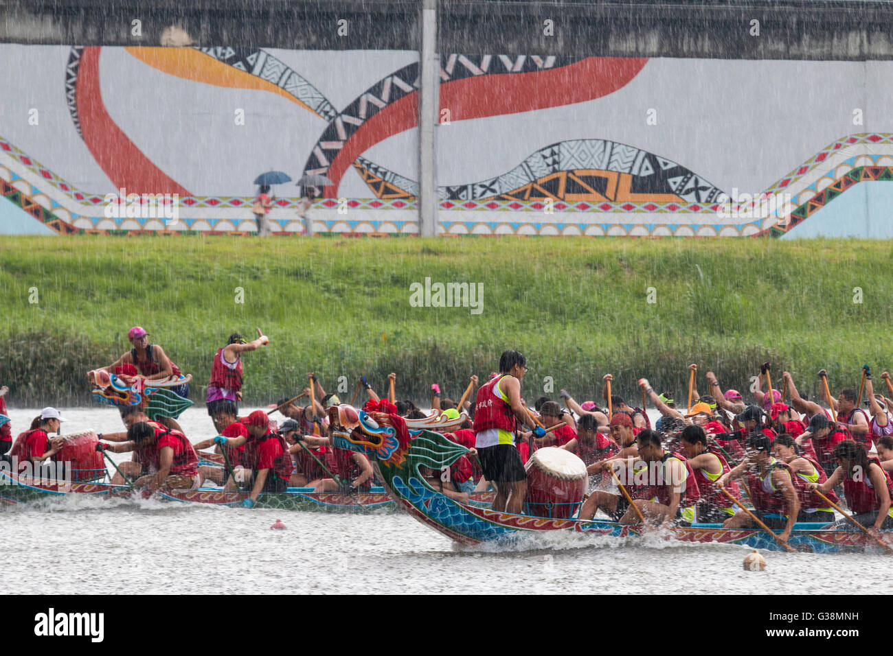 Drummers beat out the rhythm for their crews during the annual dragon boat races that took place in heavy rain on Duanwu Festival, better known as Dragon Boat Festival. Stock Photo