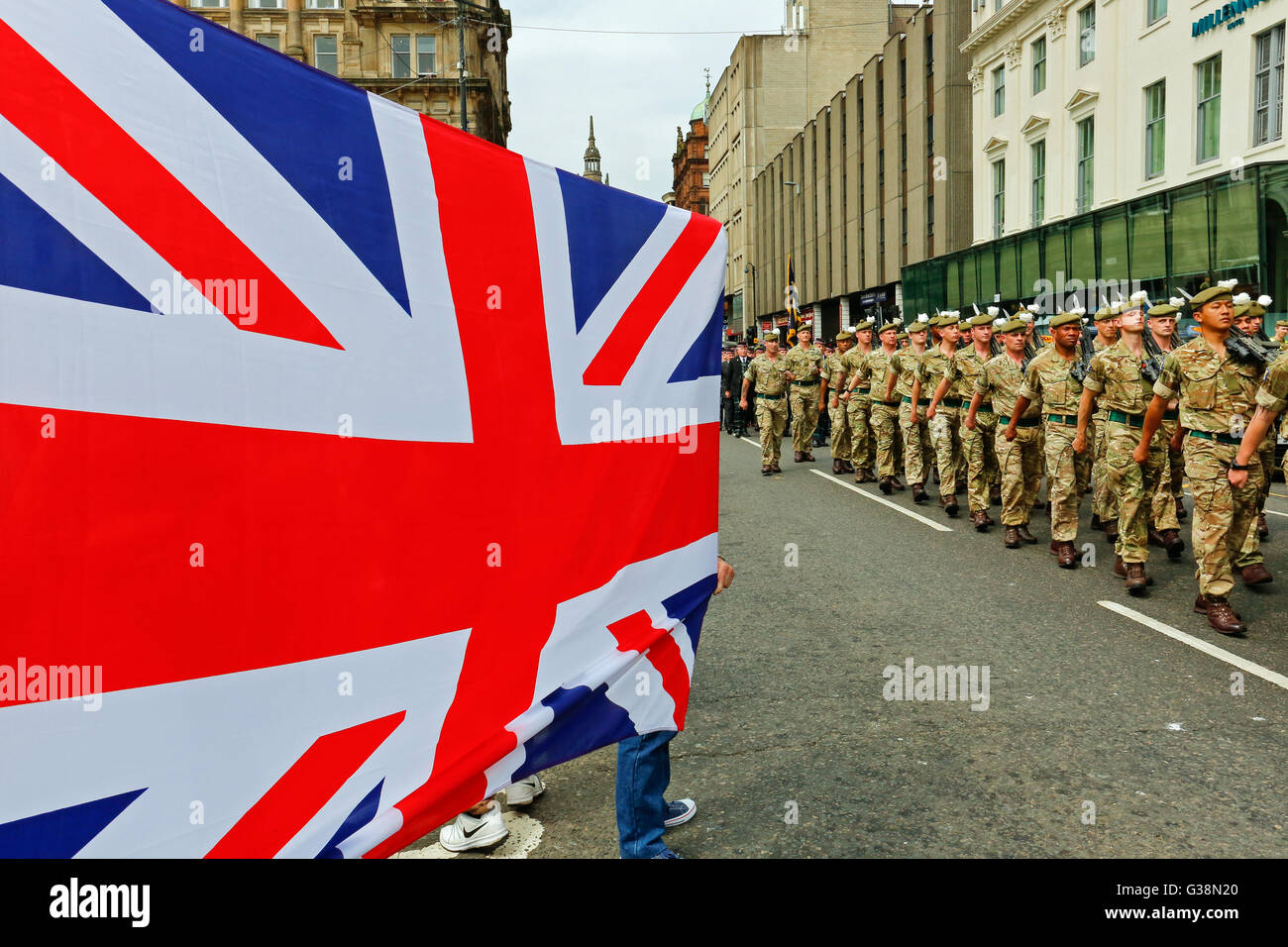 Glasgow, Scotland, UK. 9th June, 2016. Glasgow celebrated the homecoming parade of the Royal Highland Fusiliers after a successful 4 month tour in Afghanistan. Spectators lined the streets, cheering the soldiers as they marched by and the Provost of Glasgow, Sadie Docherty, welcomed them home on behalf of the City of Glasgow. Credit:  Findlay/Alamy Live News Stock Photo