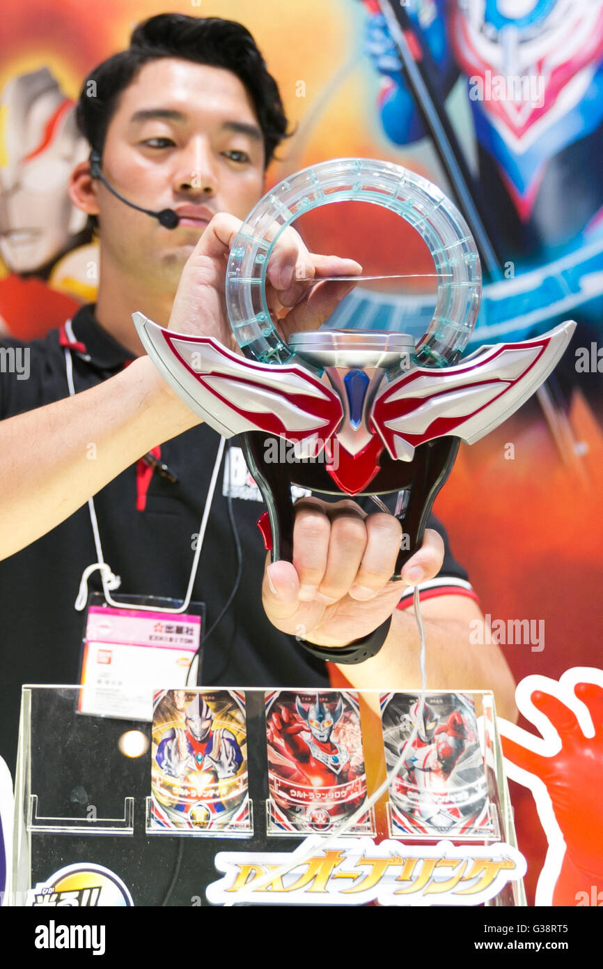 An exhibitors gives an demonstration of the Ultraman Orb DX Orb Ring at An exhibitors gives an demonstration of the Ultraman Orb DX Orb Ring at