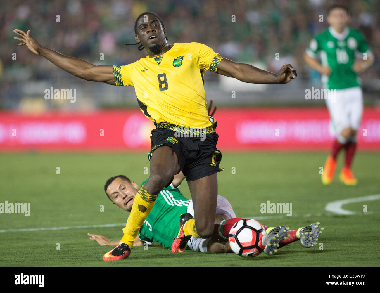 Pasadena, USA. 9th June, 2016. Jamaica's Clayton Donaldson (Top) is tackled during the Copa America Centenario tournament Group C football match between Mexico and Jamaica in Pasadena, California, the United States, on June 9, 2016. Credit:  Yang Lei/Xinhua/Alamy Live News Stock Photo