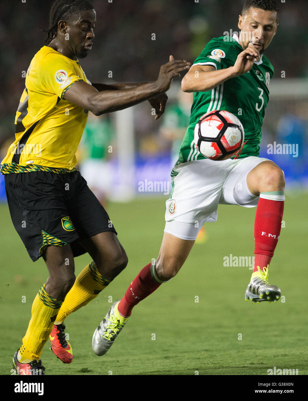 Pasadena, USA. 9th June, 2016. Mexico's Yasser Corona (R) vies for the ball during the Copa America Centenario tournament Group C football match between Mexico and Jamaica in Pasadena, California, the United States, on June 9, 2016. Credit:  Yang Lei/Xinhua/Alamy Live News Stock Photo