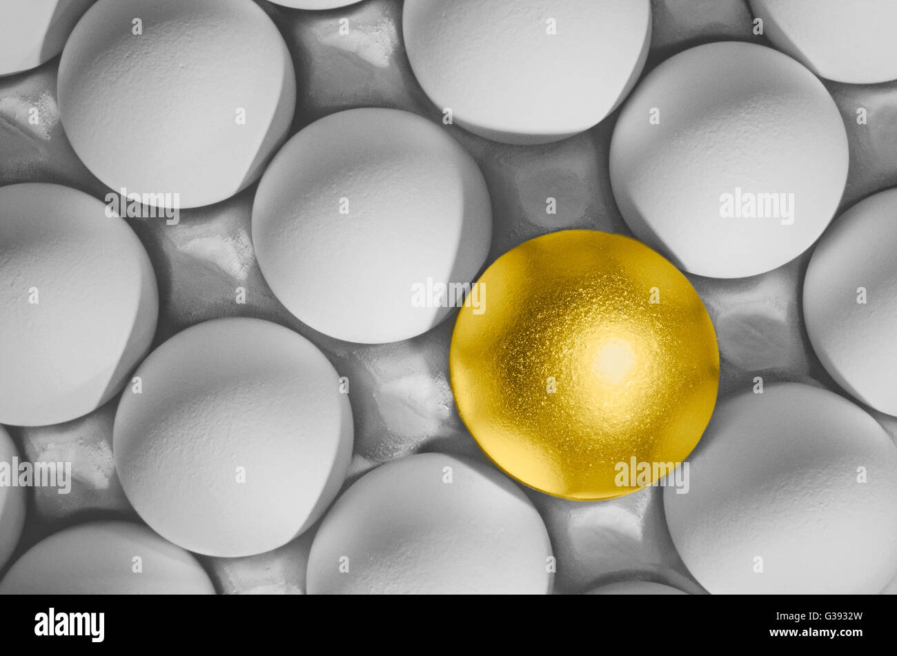 Golden Egg Amongst A Group Of White Eggs Stock Photo Alamy