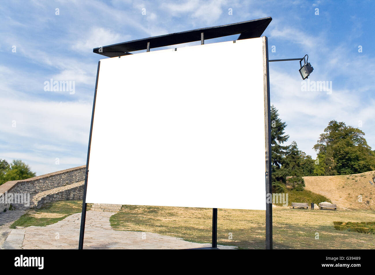 Blank billboard in a park with blue sky Stock Photo - Alamy