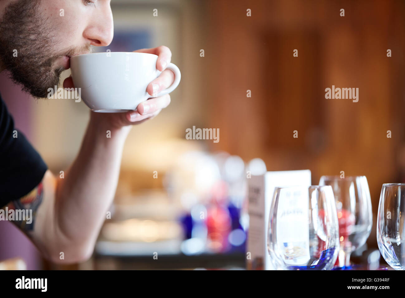 Coffee Shop Customer Holding A Large Cup Of Coffee Stock Photo Alamy