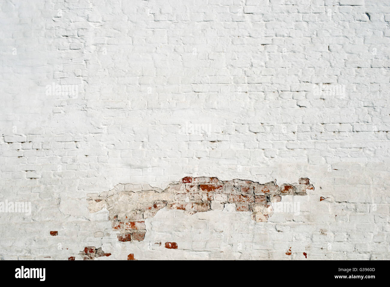 white brick wall fragment with damaged paint part Stock Photo Alamy