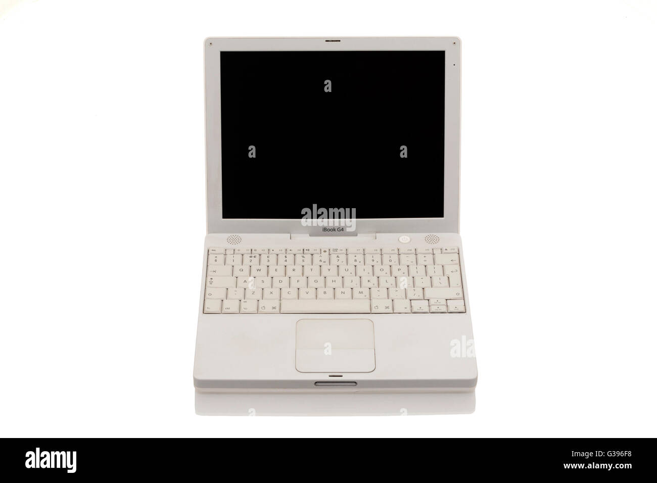Apple iBook G4 laptop / lap top computer with scrolling TrackPad / trackpad / track pad, blank screen & keyboard. Stock Photo