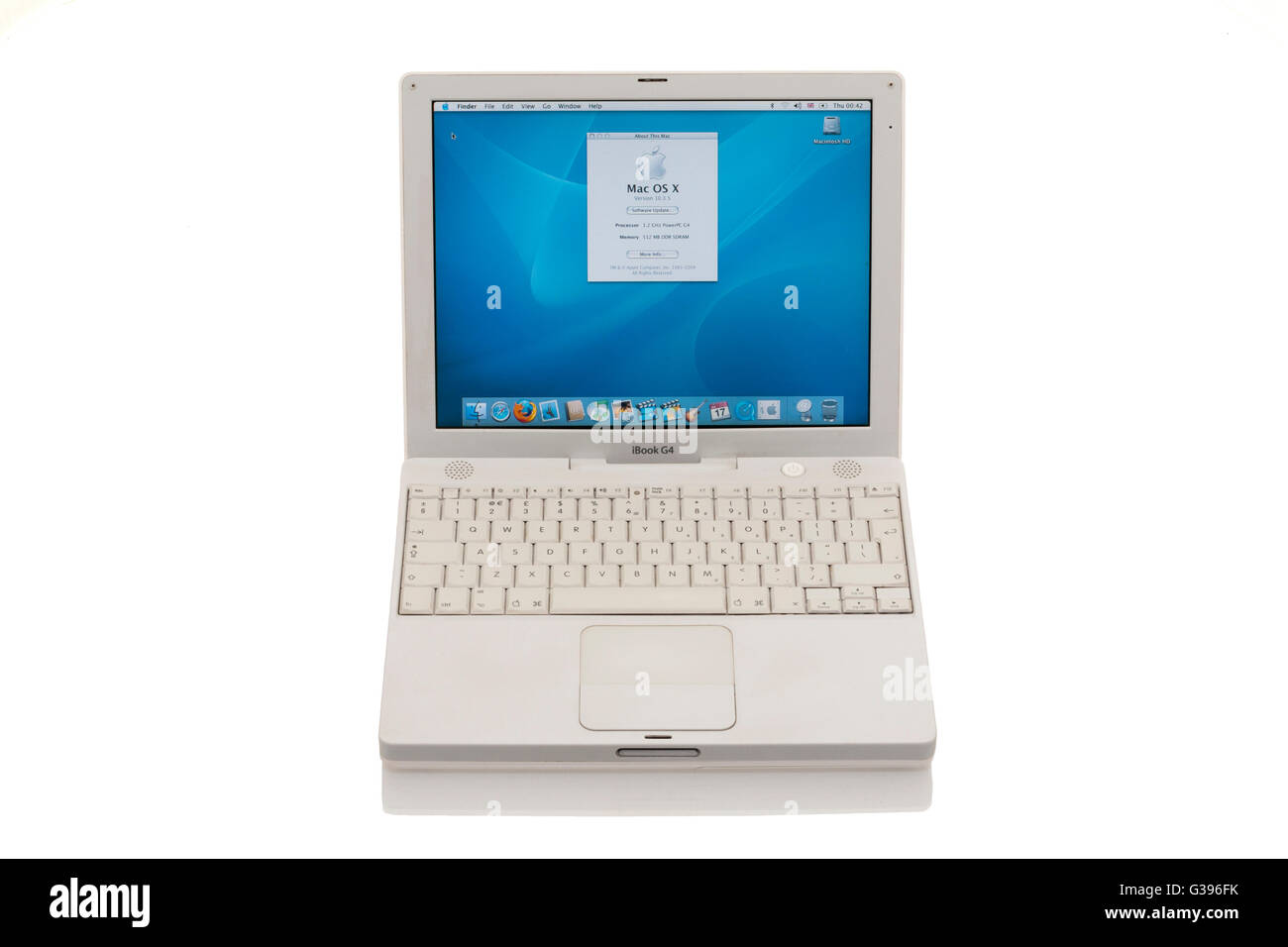 Apple iBook G4 laptop / lap top computer with scrolling TrackPad / trackpad / track pad, ' about this Mac ' screen & keyboard. Stock Photo