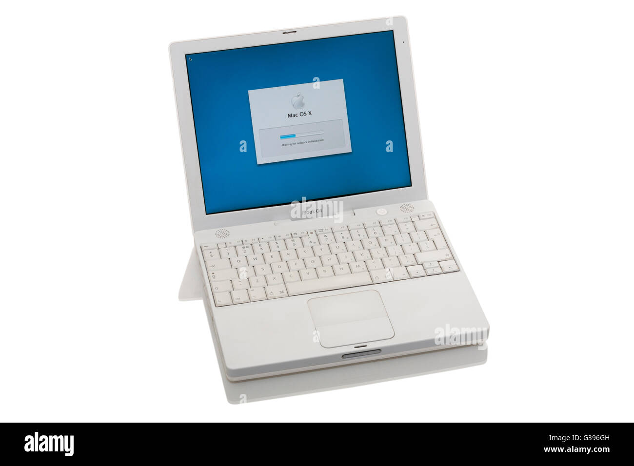 Apple iBook G4 laptop / lap top computer with scrolling TrackPad / trackpad / track pad, start / starting up screen & keyboard. Stock Photo