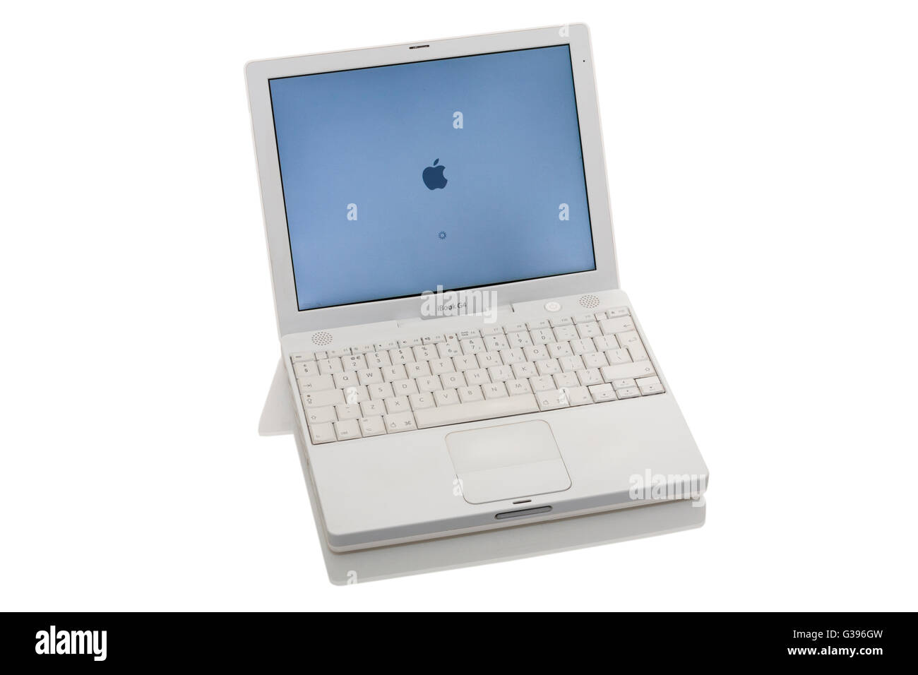 Apple iBook G4 laptop / lap top computer with scrolling TrackPad / trackpad / track pad, start / starting up screen & keyboard. Stock Photo