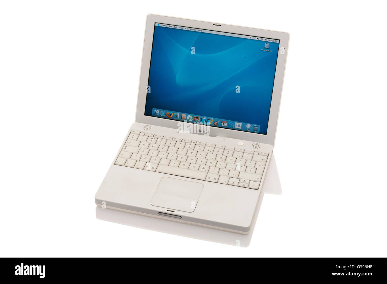 Apple iBook G4 laptop / lap top computer with scrolling TrackPad / trackpad / track pad, start / starting up screen & keyboard. Stock Photo