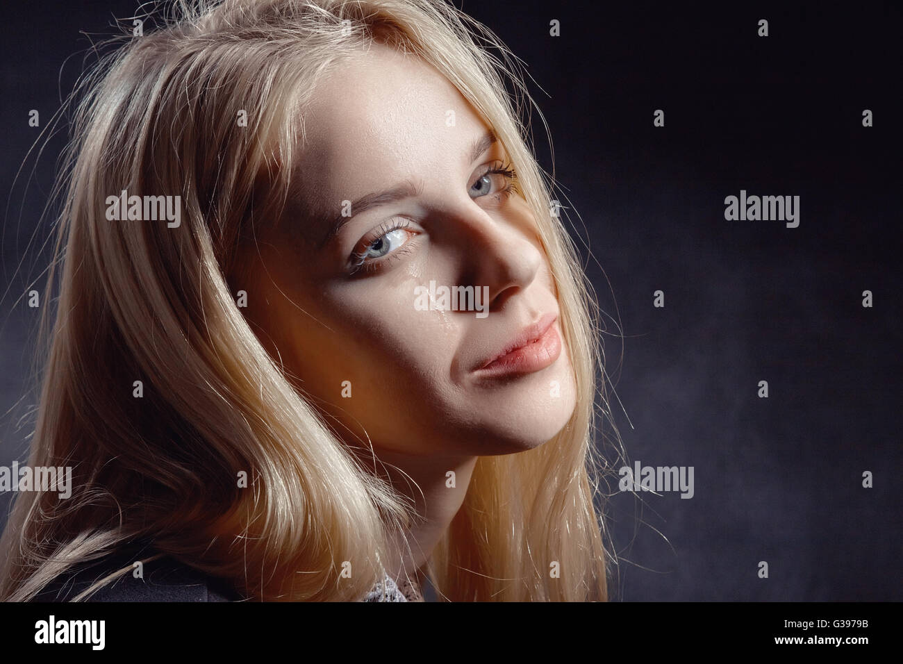 sad girl crying on black background Stock Photo - Alamy