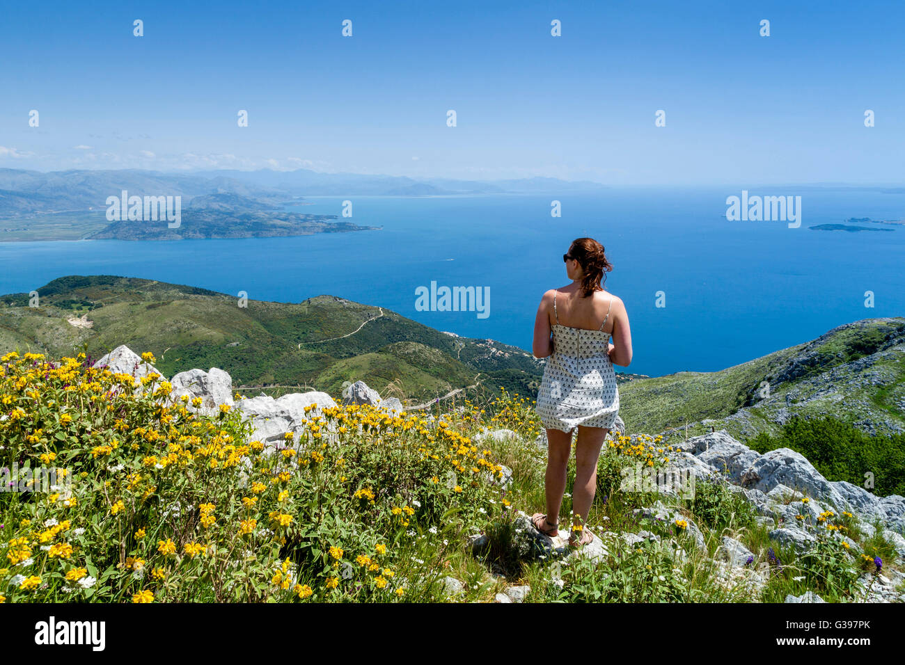 A Young Woman Looking At The Views From Mount Pantokrator, Corfu Island, Greece Stock Photo