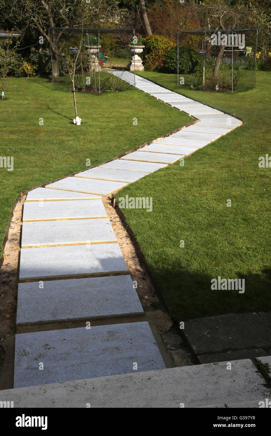 Laying New Garden Path New Concrete Slabs Surrey England Stock Photo