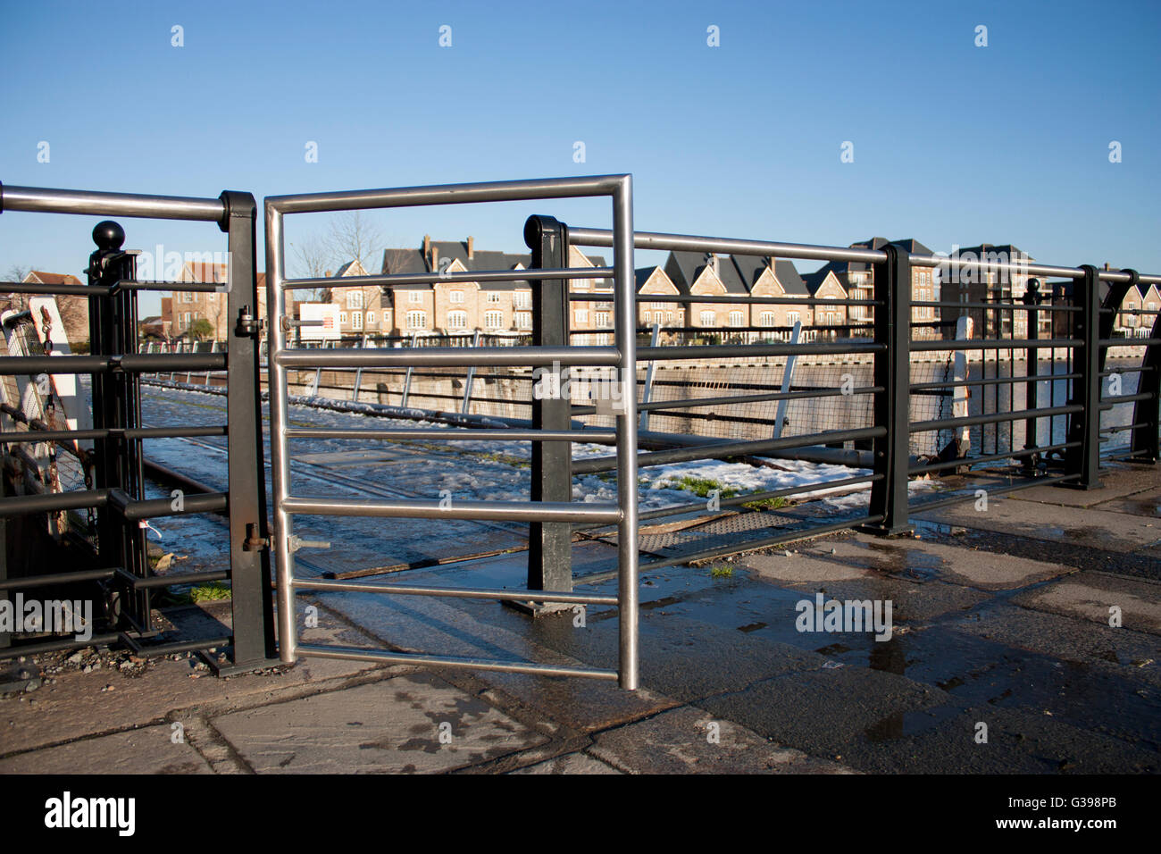 Gate leading to a walkway connecting St Marys Island, Chatham, Kent - home of the old Royal Naval Dockyard Stock Photo