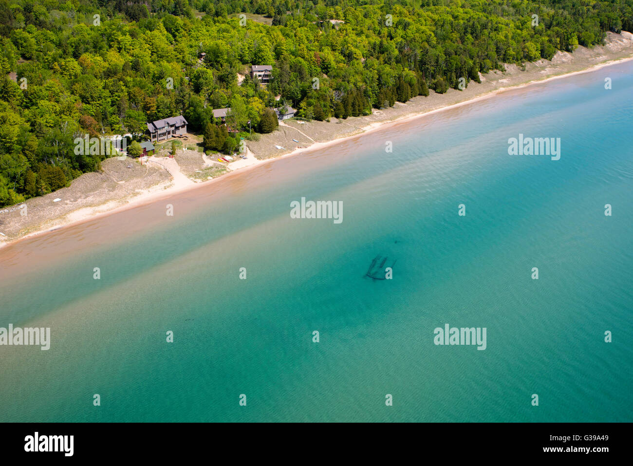 A sunken ship's carcass sits in the waters of Lake Michigan, off of the