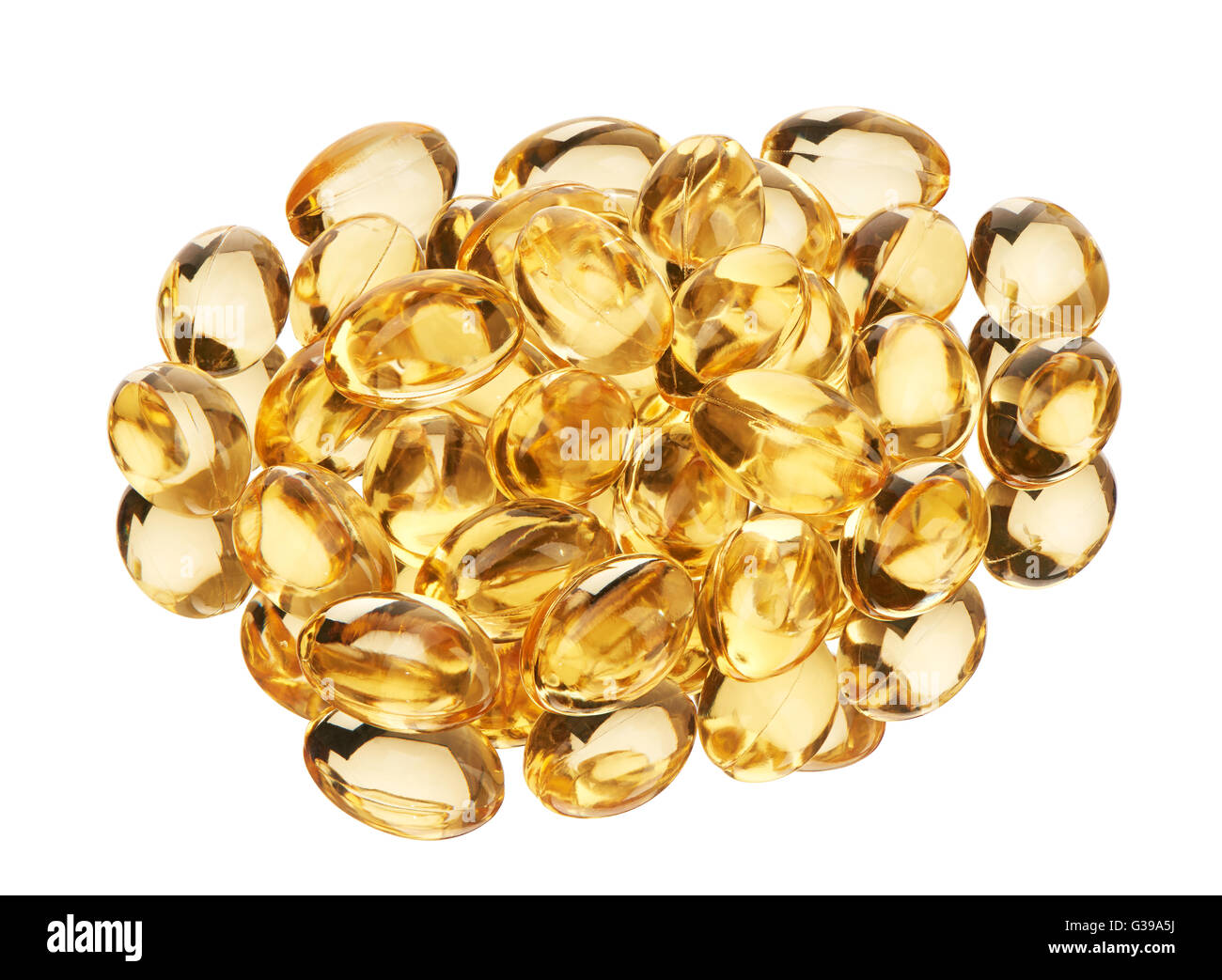 Pile of soft gel capsules with golden color oil supplements isolated on white background. Clipping path included. Stock Photo