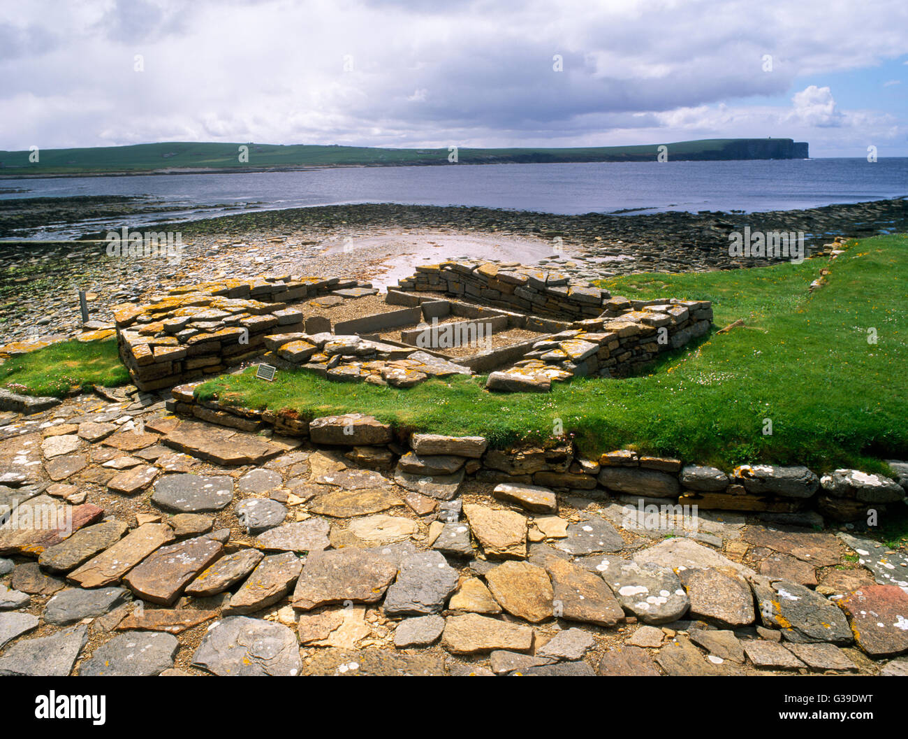 Viking-age paved street with covered drain beside remains of a bathhouse/sauna on the tidal island of Brough of Birsay, off Mainland, Orkney. Stock Photo