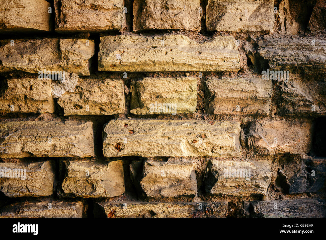 Background of old yellow brick wall texture Stock Photo - Alamy