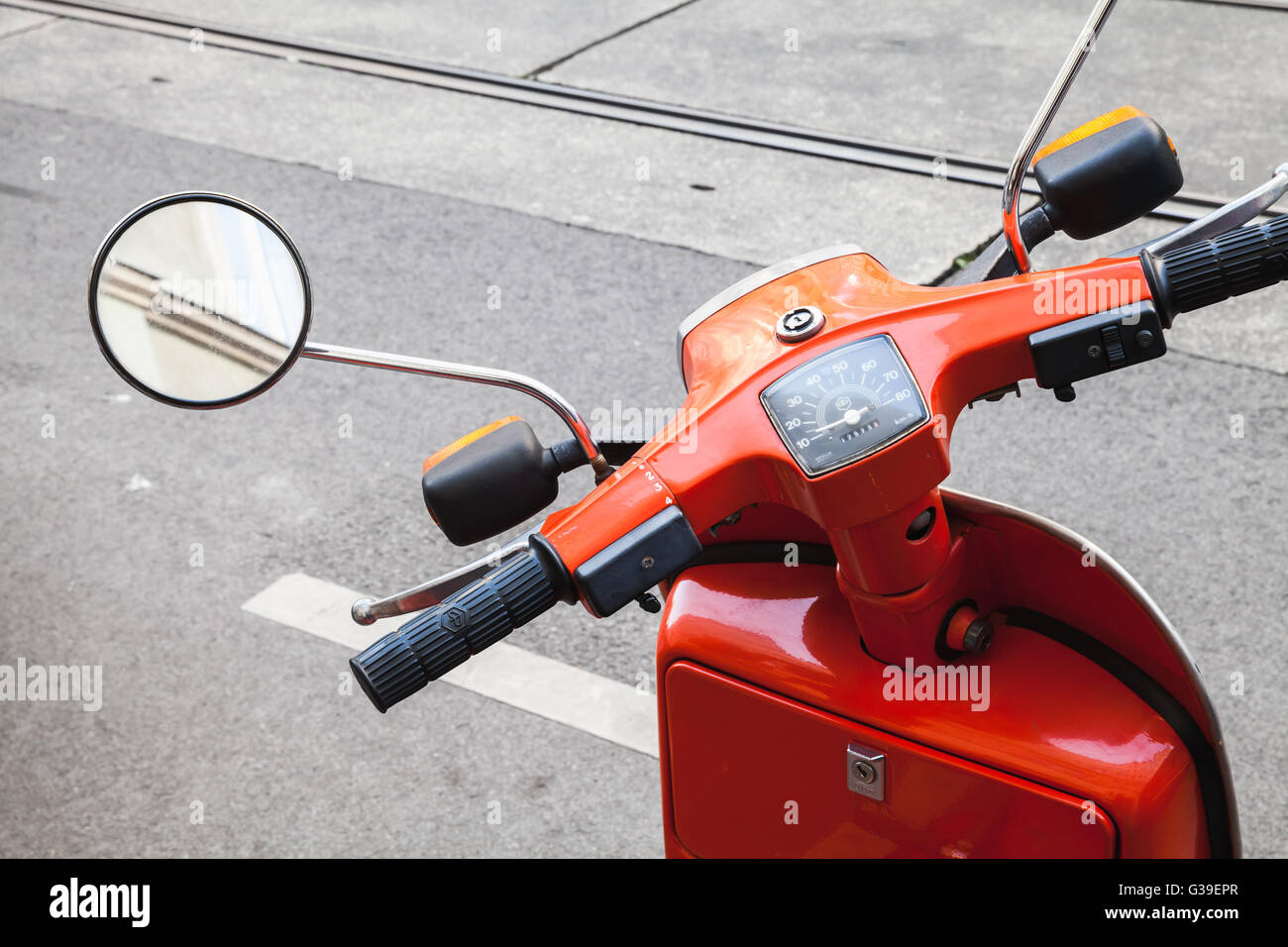 Vienna, Austria - November 4, 2015: Classical Italian Piaggio scooter handlebar with speedometer and mirror, closeup photo Stock Photo