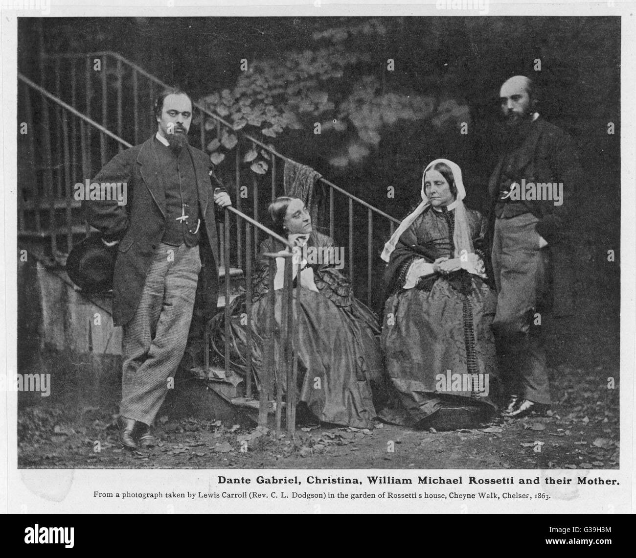 Poet and artist, Dante Gabriel Rossetti (1828-1882), with his sister Christina, his brother William Michael, and their mother in a photograph by Lewis Carroll (Rev CL Dodgson), 1863     Date: 1863 Stock Photo