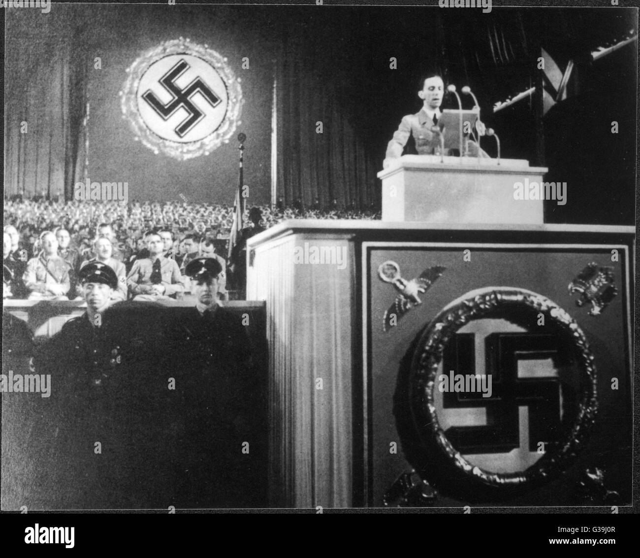 Paul Joseph Goebbels (1897-1945), speaking on the World Danger of Bolshevism,  while Himmler, Hitler and Hess look on.     Date: 11th September 1936 Stock Photo
