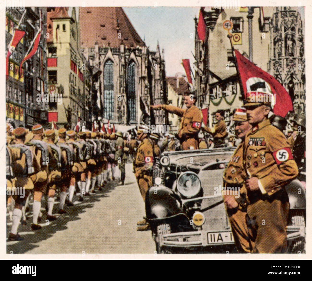 Hitler salutes followers at  Nurnberg Reichsparteitag.         Date: September 1934 Stock Photo