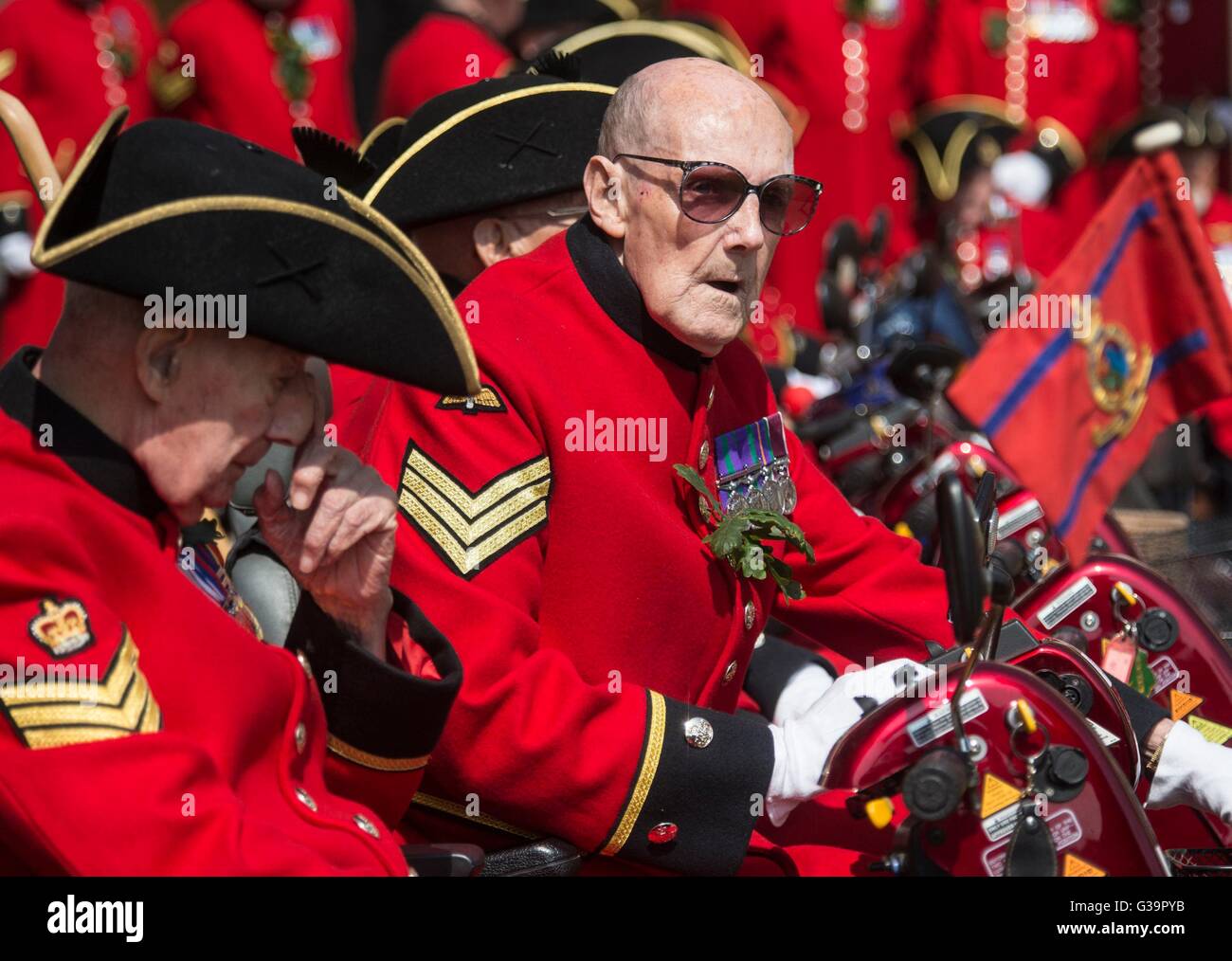 A Chelsea Pensioner sits on his mobility scooter as the Princess Royal