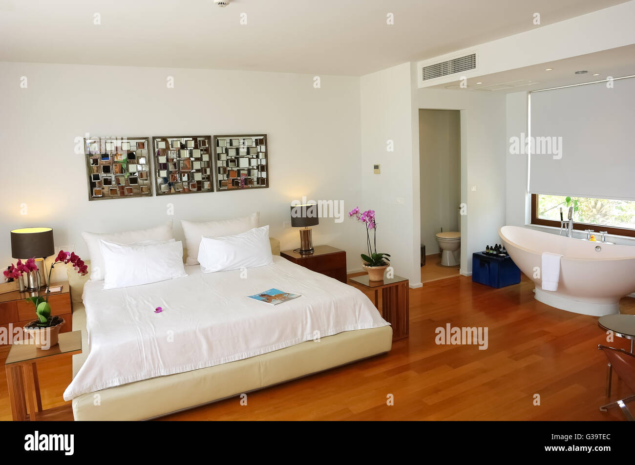 HERAKLION, CRETE, GREECE - MAY 13, 2014: The Interior room with big bed and bath in modern building of luxury class hotel Stock Photo