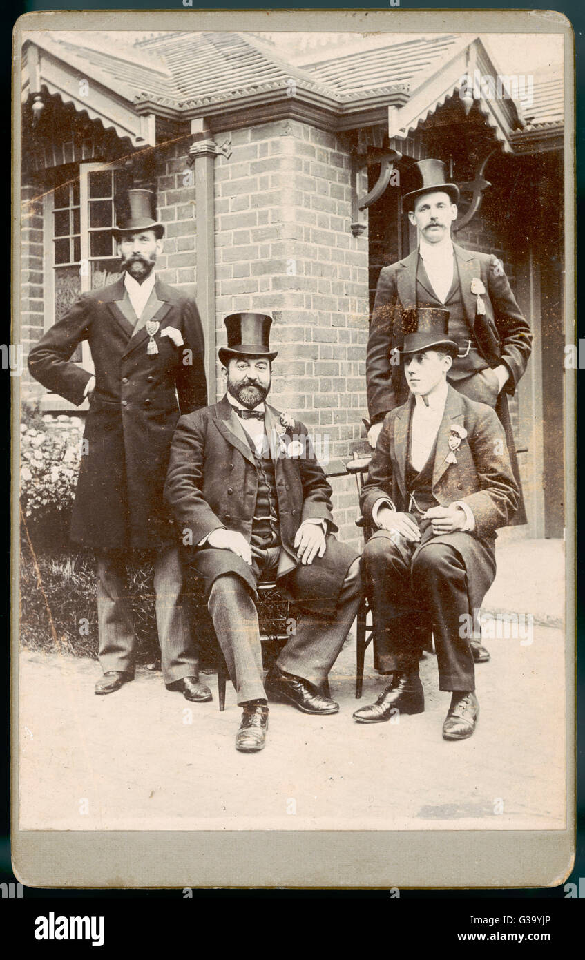 Four Men in Top Hats Stock Photo