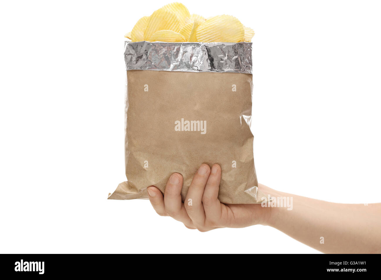 Close-up on a hand holding a brown bag full of potato chips isolated on  white background Stock Photo - Alamy