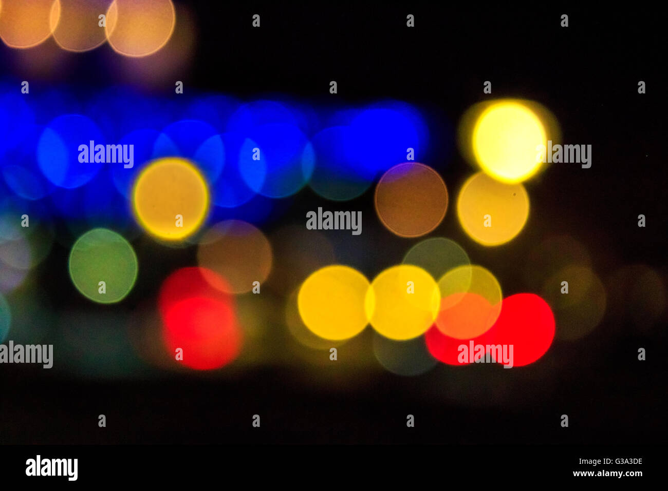 Abstract Background Of Blurred Warm Lights With Cool Blue And Purple