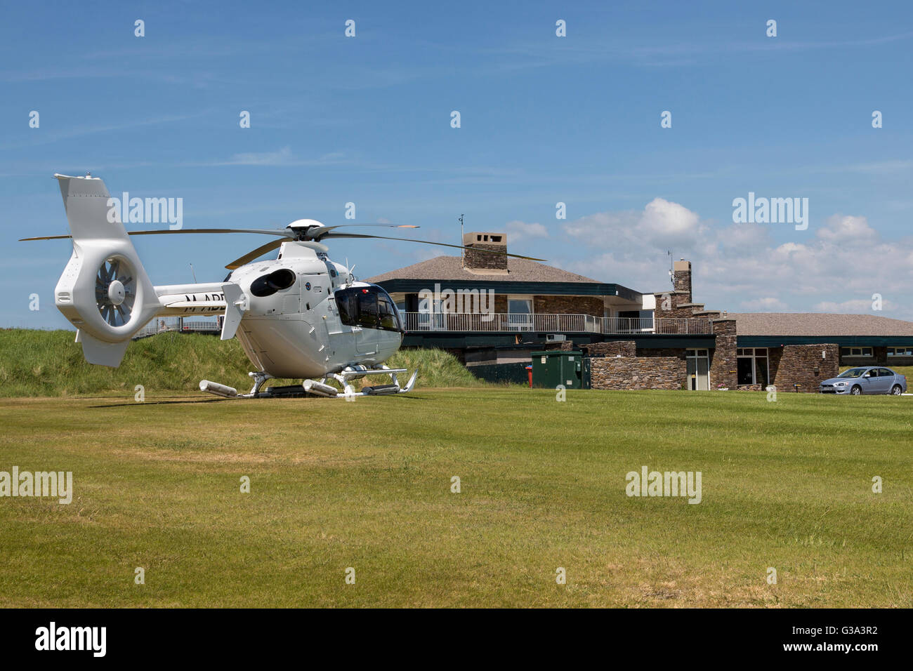 Waterville golf course club house with helicopter in grounds. County