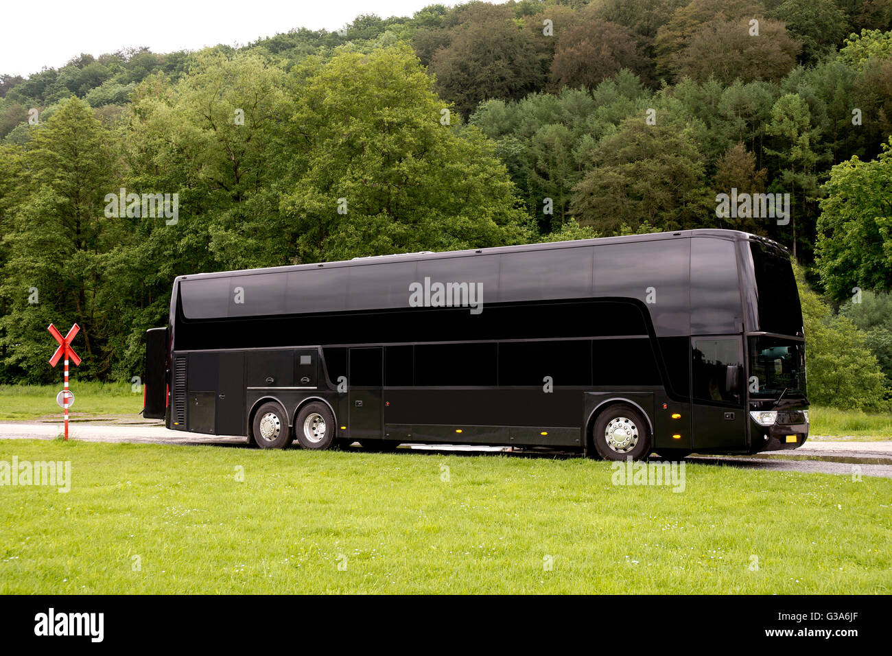 Black Travel bus standing in a country road Stock Photo Alamy