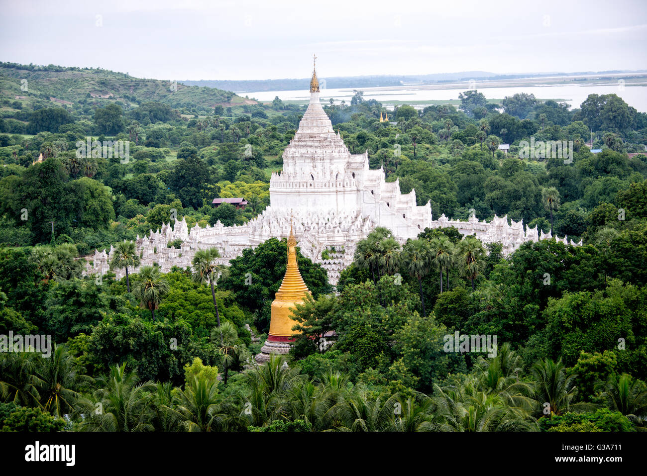 Built in 1816 and located in Mingun, not far from Mandalay, Hsinbyume Pagoda is designed in inspiration from Buddhist mythological mountain, Mount Meru. It features 7 levels of distinctive and unique whitewashed waves. Stock Photo