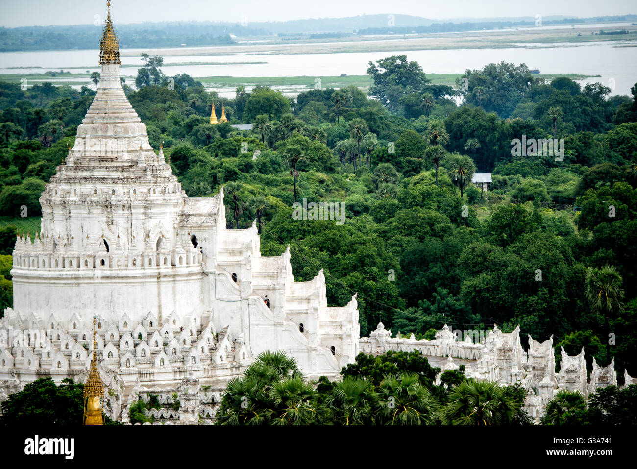 Built in 1816 and located in Mingun, not far from Mandalay, Hsinbyume Pagoda is designed in inspiration from Buddhist mythological mountain, Mount Meru. It features 7 levels of distinctive and unique whitewashed waves. Stock Photo